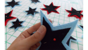 Snap-in grommets and hot glue make this project easy and "sew" cute! This was the latest addition to a super hero room, but can go with so many themes. 