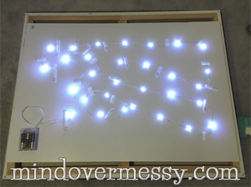 Cute by day, Light by Night! A great way to add a city scape to your super heroes walls if you do not want to stencil. A "how to" for battery operated LED lights included. 