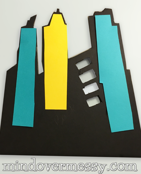 Cute by day, Light by Night! A great way to add a city scape to your super heroes walls if you do not want to stencil. A "how to" for battery operated LED lights included. 